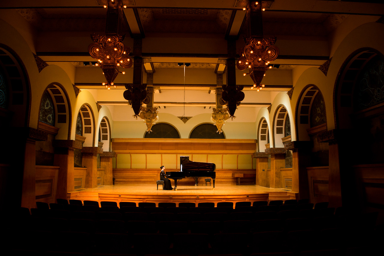 Pianist performing on Ganz Hall stage