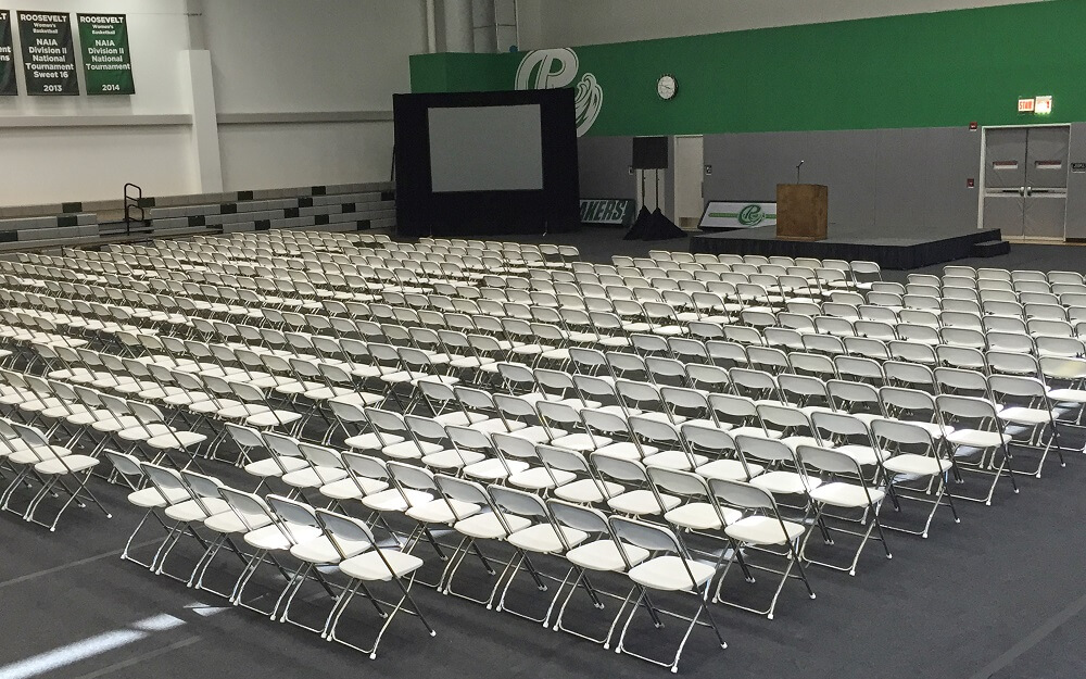 Large room with rows of chairs set up for a lecture or presentation.
