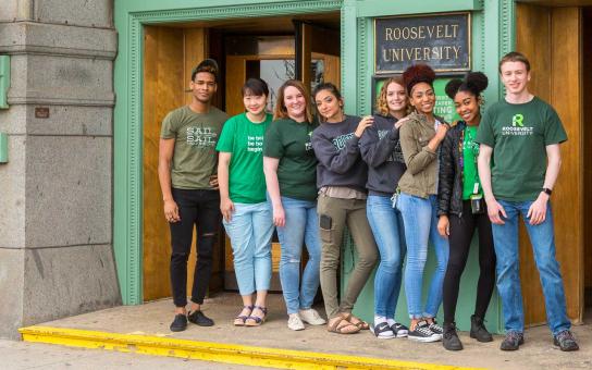 Students at the front door of auditorium building