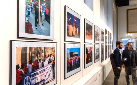 Photographs hang on the wall of the Gage Gallery at Roosevelt University