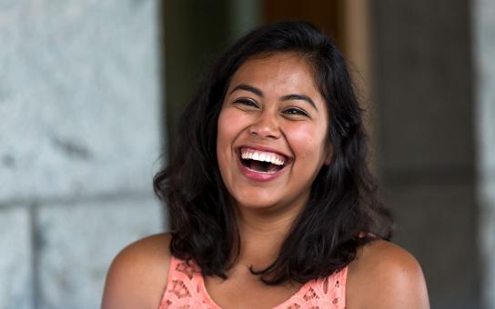 Student laughing outside of the Auditorium Building