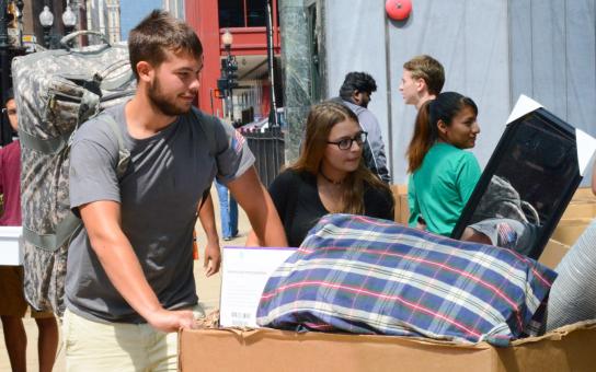 Student pushing move-in cart